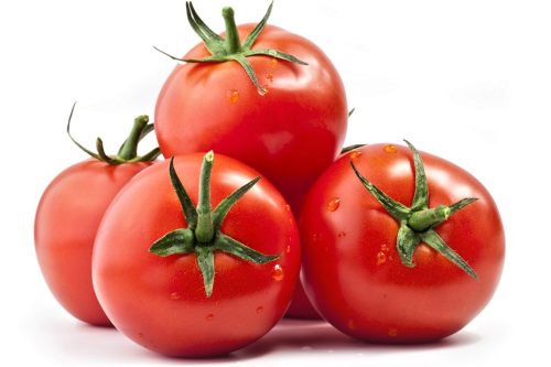 Tomatos Tomatos with a light shadow isolated on white